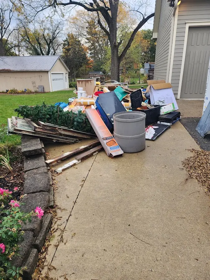 Dumpster being loaded with debris for 30 Yard Dumpster Rental in Eatontown